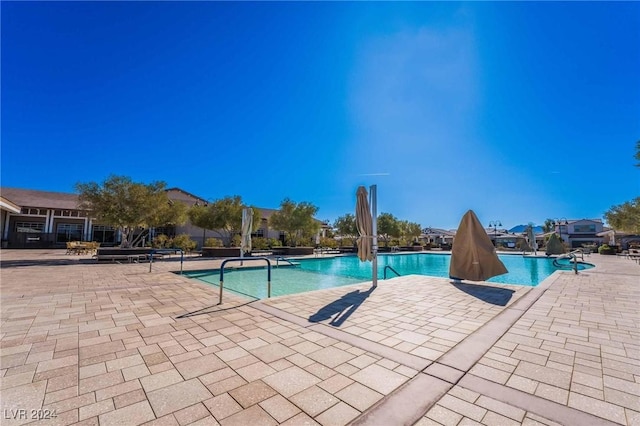 view of swimming pool featuring a patio area