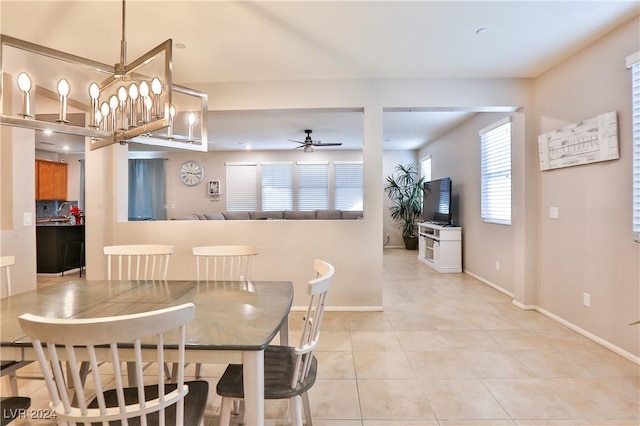 dining area featuring ceiling fan and light tile patterned flooring