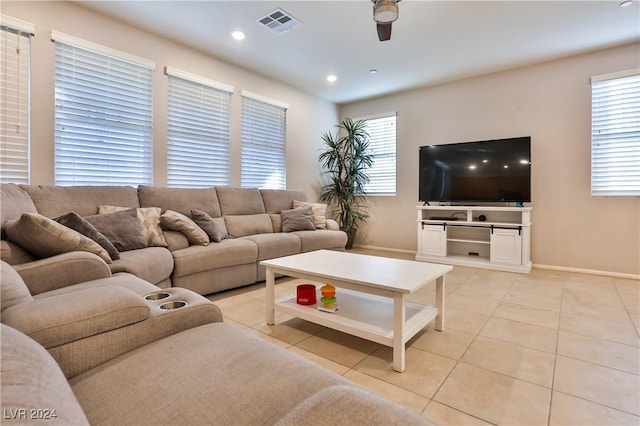 living room with plenty of natural light, ceiling fan, and light tile patterned floors