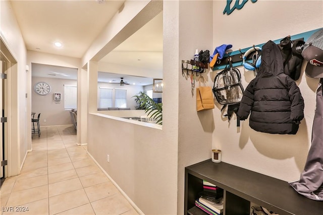 mudroom with ceiling fan and light tile patterned flooring