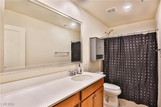 bathroom with walk in shower, tile patterned flooring, vanity, and toilet