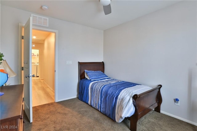 bedroom featuring dark colored carpet and ceiling fan