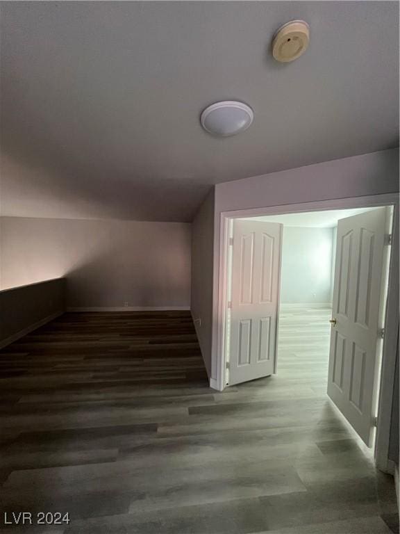 hallway featuring dark wood-type flooring