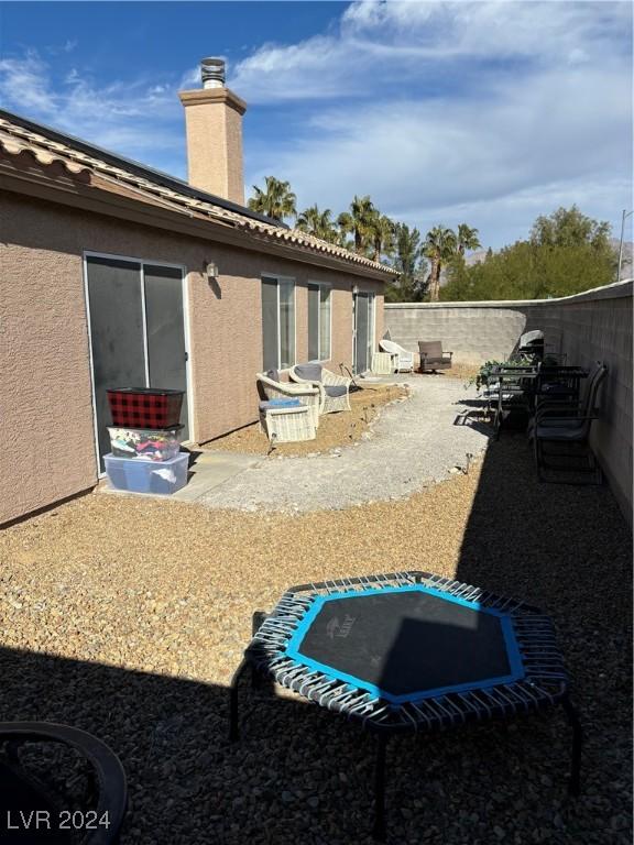 exterior space featuring a patio and a trampoline