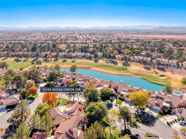 birds eye view of property featuring a water and mountain view