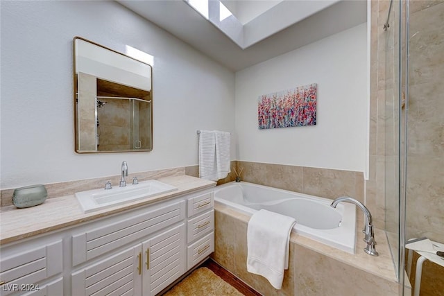 5035 Shoal Creek Cir, Las Vegas, NV 89113 - bathroom with vanity, a garden tub, tiled shower, and a skylight