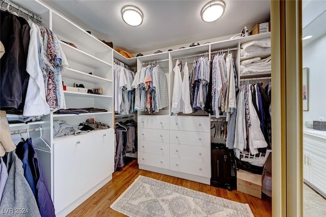 5035 Shoal Creek Cir, Las Vegas, NV 89113 - walk in closet featuring wood finished floors
