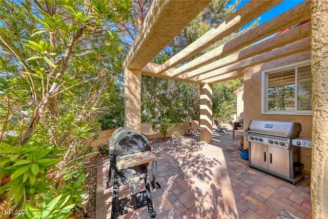 view of patio featuring a grill and a pergola