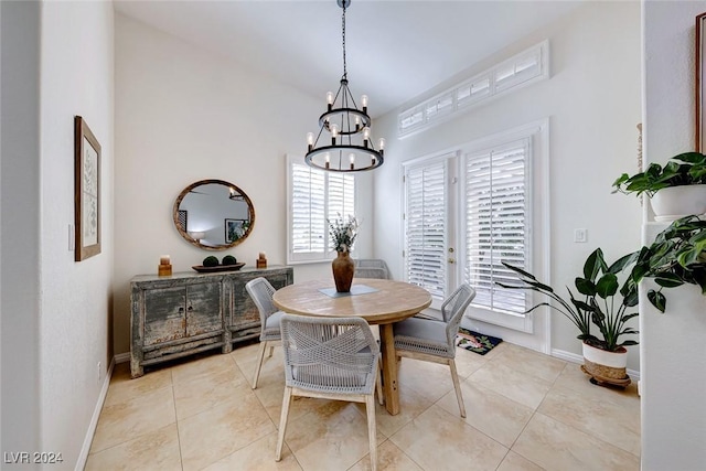 5035 Shoal Creek Cir, Las Vegas, NV 89113 - dining space featuring a chandelier, baseboards, and light tile patterned floors