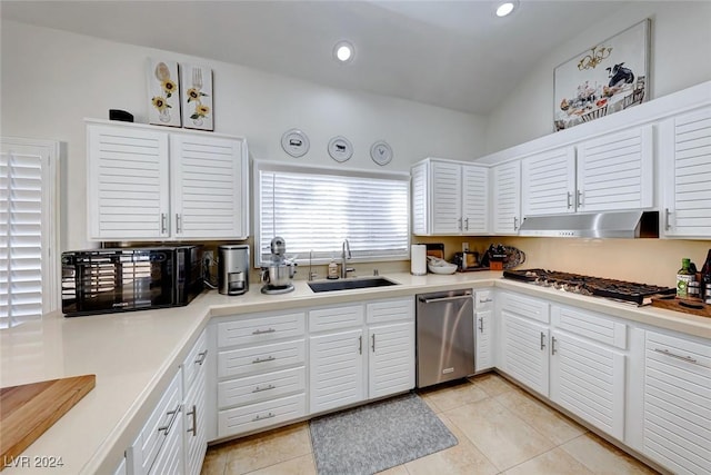 5035 Shoal Creek Cir, Las Vegas, NV 89113 - kitchen with a sink, stainless steel appliances, under cabinet range hood, light tile patterned flooring, and recessed lighting