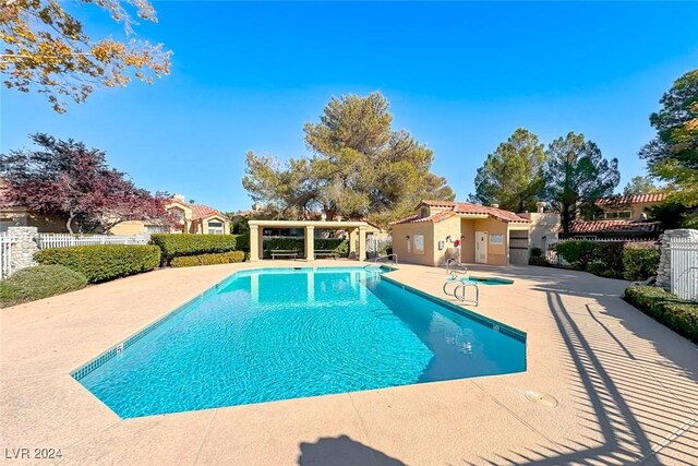 view of swimming pool featuring a patio area