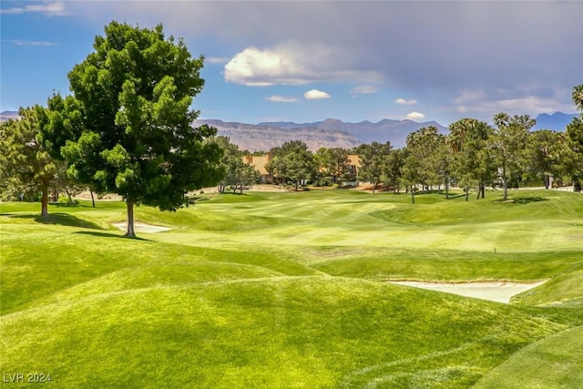 5035 Shoal Creek Cir, Las Vegas, NV 89113 - view of community featuring a mountain view, view of golf course, and a lawn