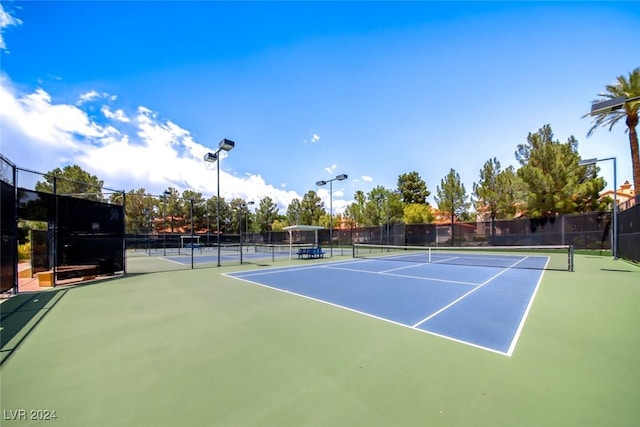 view of tennis court with basketball court