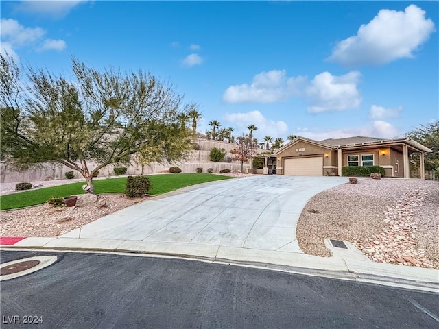 view of front of property with a garage and a front lawn