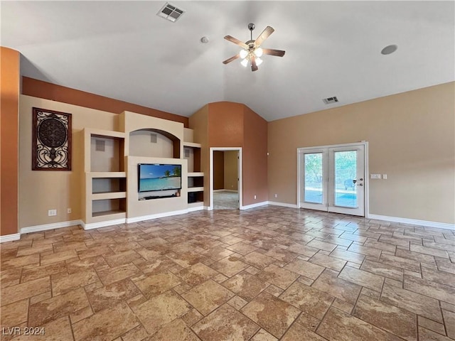 unfurnished living room with ceiling fan and high vaulted ceiling