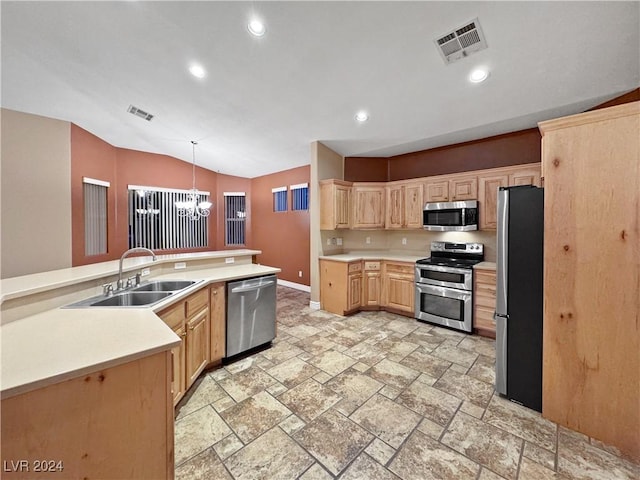 kitchen with decorative light fixtures, light brown cabinets, lofted ceiling, and appliances with stainless steel finishes