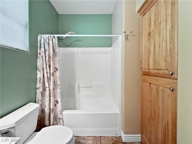 bathroom with tile patterned flooring, toilet, and shower / tub combo with curtain