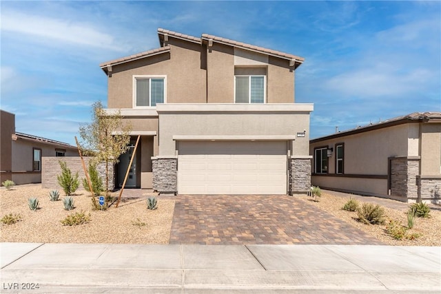 view of front of property with a garage