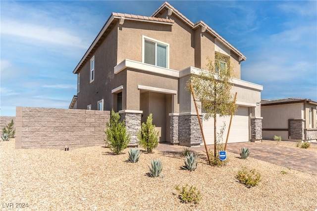 view of front of home with a garage