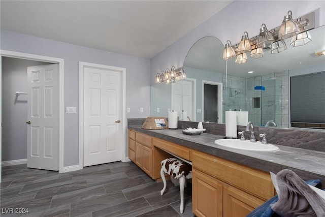 bathroom with vanity and a shower with shower door