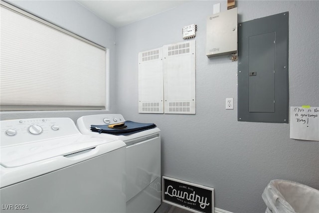 laundry area with separate washer and dryer and electric panel