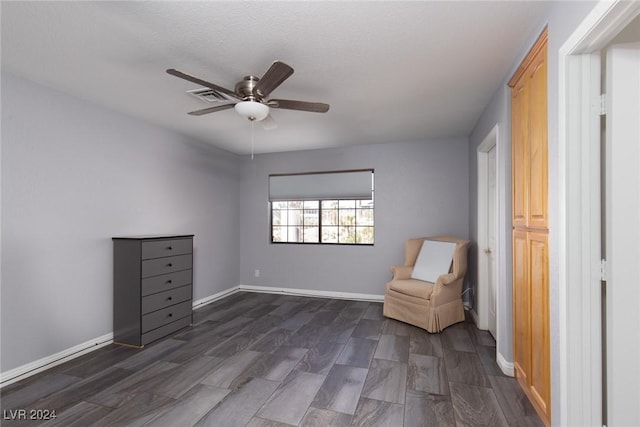 unfurnished room featuring ceiling fan and dark hardwood / wood-style floors