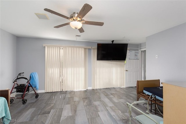 interior space with ceiling fan and light hardwood / wood-style flooring