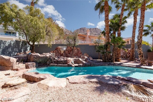 view of swimming pool featuring a mountain view