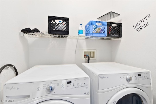 washroom featuring washing machine and clothes dryer