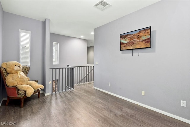 living area with hardwood / wood-style flooring