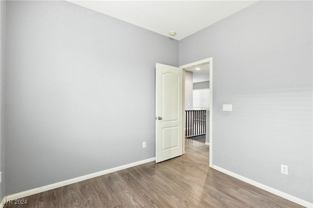 empty room featuring wood-type flooring