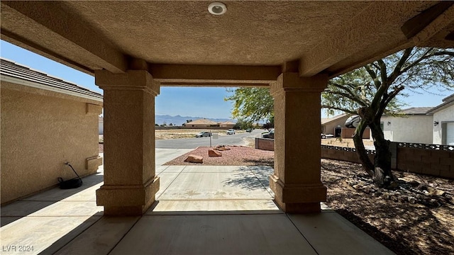 view of patio with a mountain view