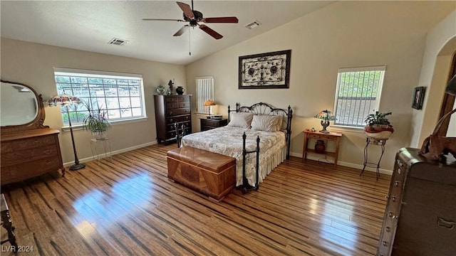 bedroom featuring multiple windows, wood-type flooring, vaulted ceiling, and ceiling fan