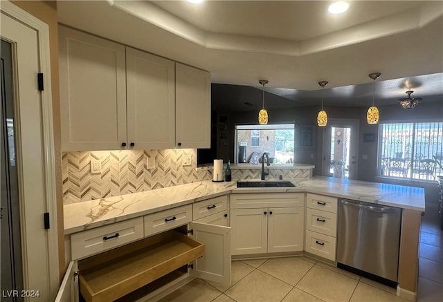 kitchen featuring dishwasher, decorative light fixtures, white cabinets, and sink