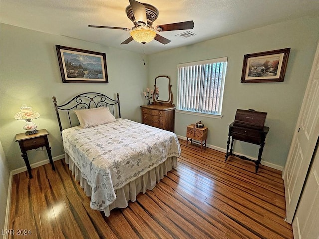 bedroom with ceiling fan and wood-type flooring