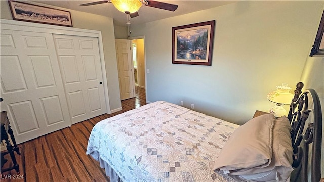 bedroom with dark hardwood / wood-style flooring, a closet, and ceiling fan