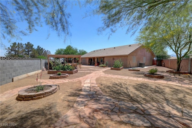 back of house with a patio area and a pergola