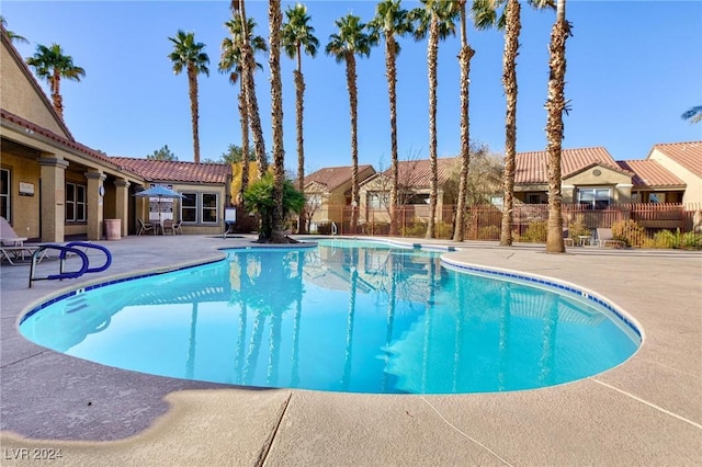 view of swimming pool featuring a patio area