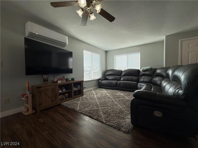 living room featuring a wall mounted air conditioner, a textured ceiling, dark hardwood / wood-style floors, and ceiling fan