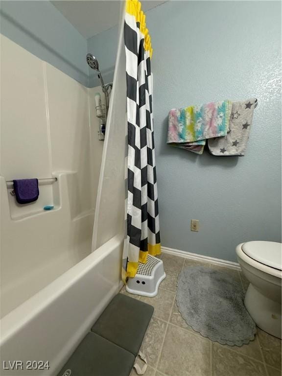 bathroom featuring tile patterned floors, shower / tub combo with curtain, and toilet