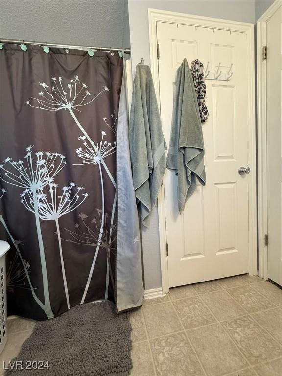 bathroom with tile patterned flooring