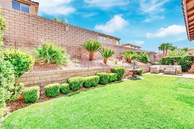 view of yard with outdoor lounge area and a patio