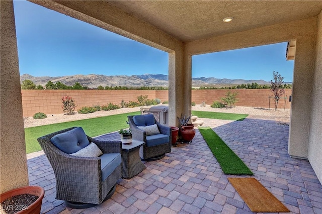 view of patio / terrace featuring a mountain view