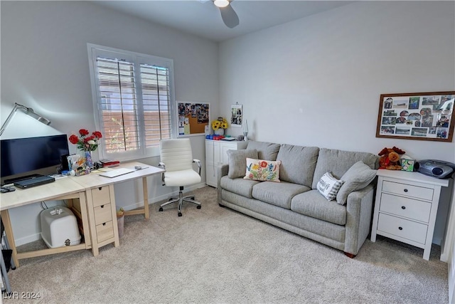 carpeted home office with ceiling fan