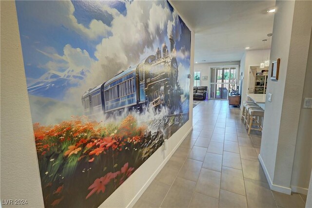 hallway featuring tile patterned flooring