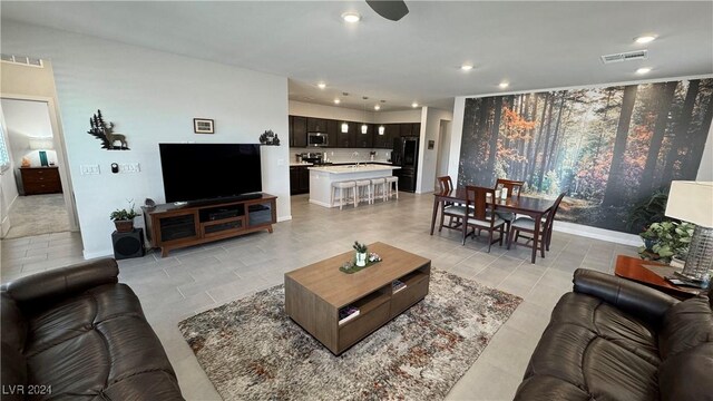 living room with light tile patterned floors