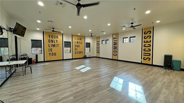 interior space with ceiling fan and light hardwood / wood-style flooring