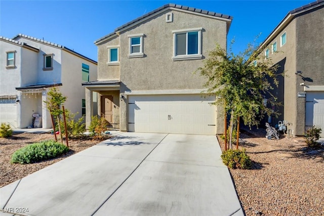 front of property with a garage