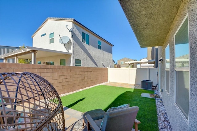 view of yard featuring cooling unit and a patio