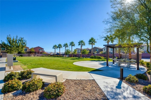 view of property's community with a lawn